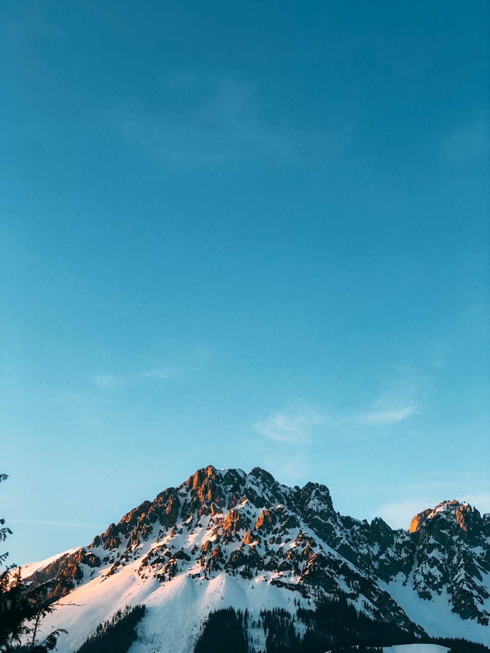 snow covered mountain under blue sky during daytime