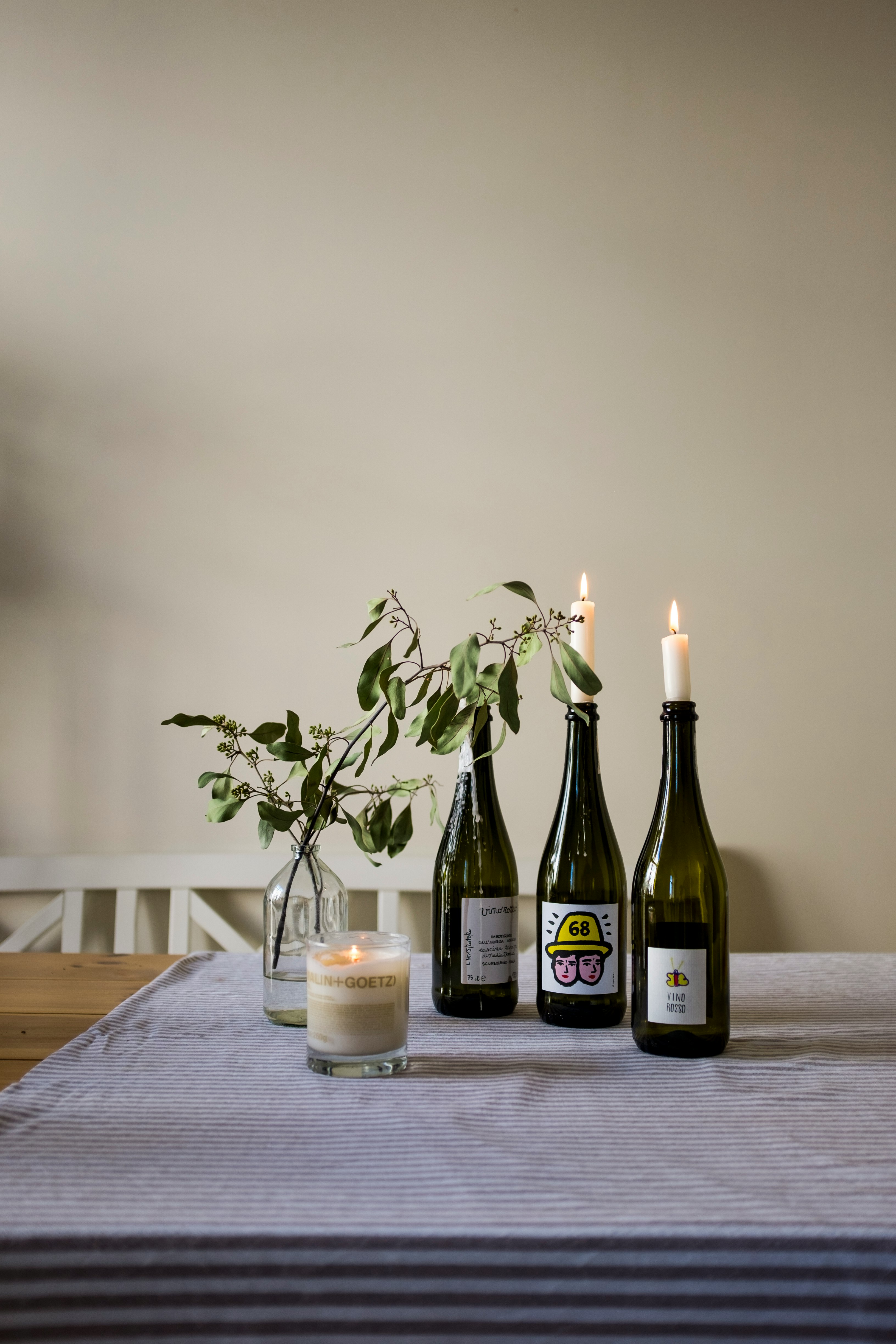 green wine bottle on brown wooden table