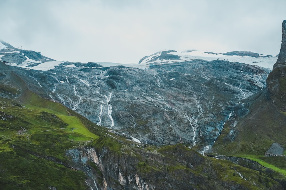 gray and white mountains under white sky during daytime