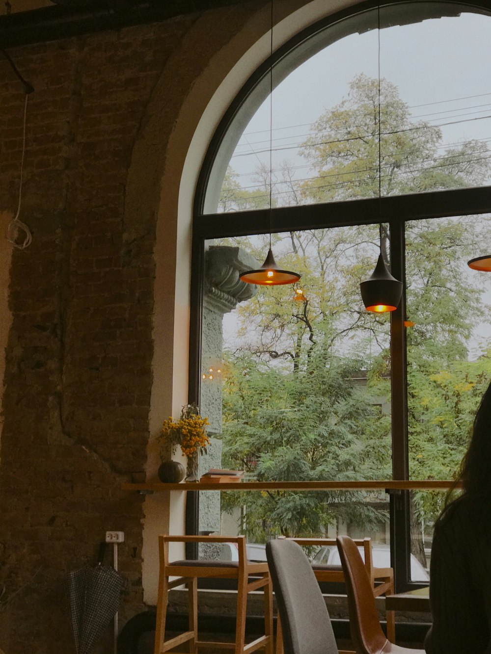 brown wooden table near window