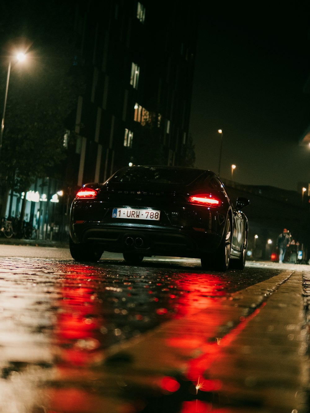 black car on road during night time