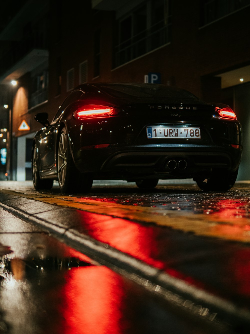 black bmw car on road during night time