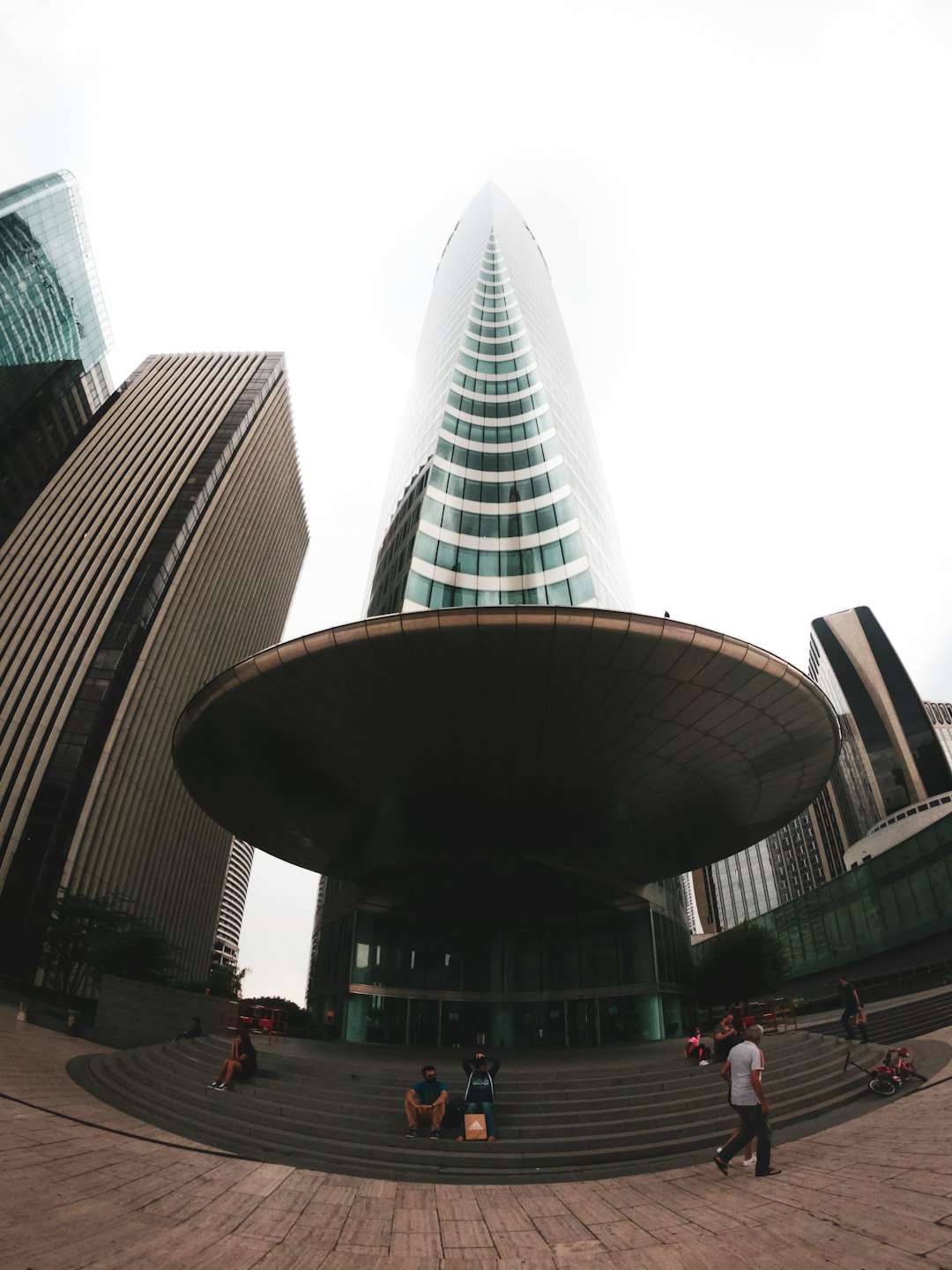 people walking on street near high rise building during daytime