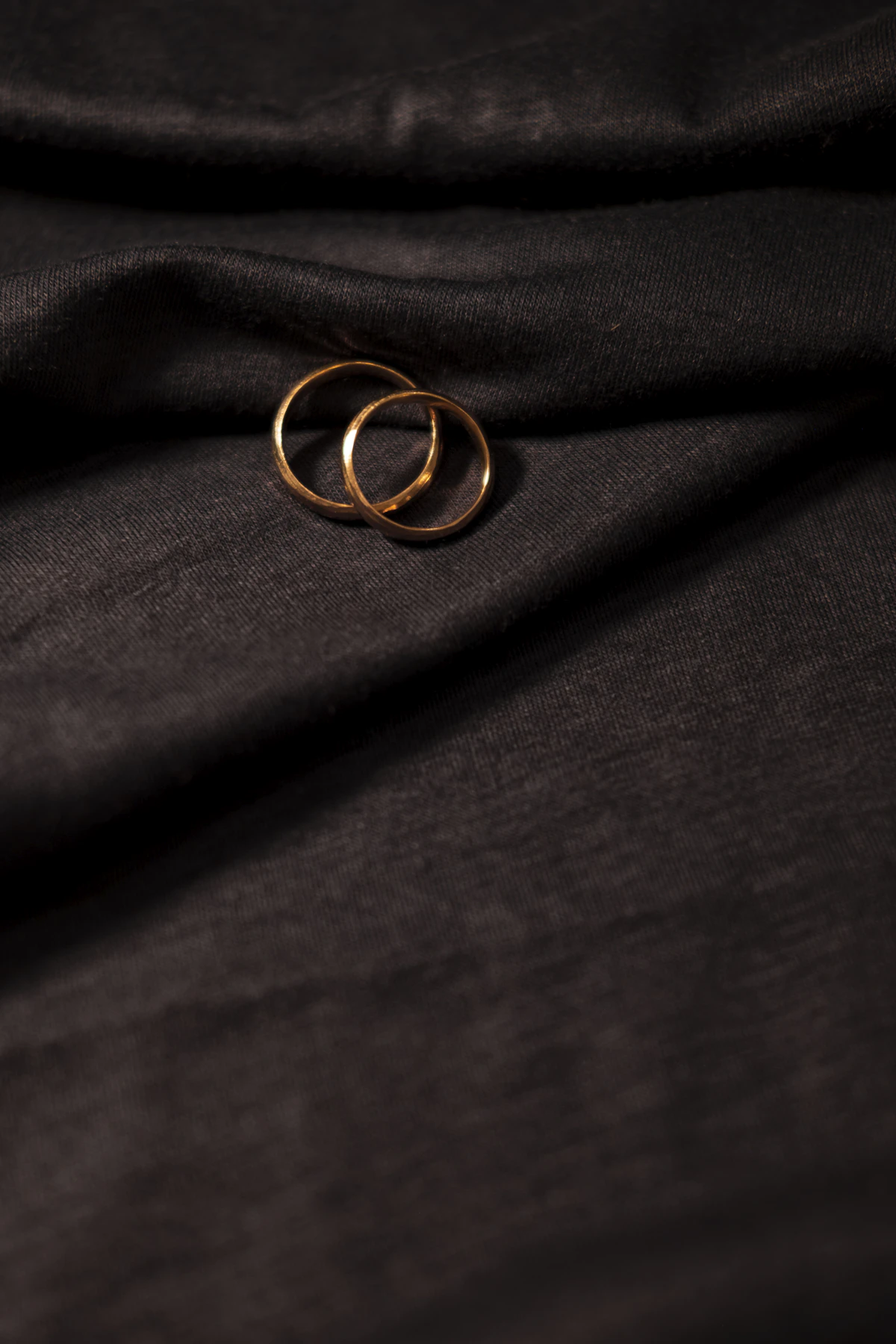 Gold ring on black textile
