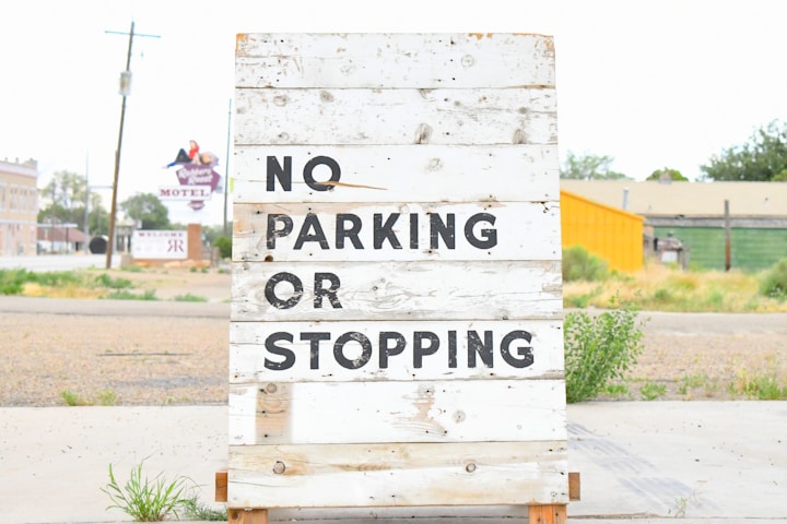 white and black wooden signage