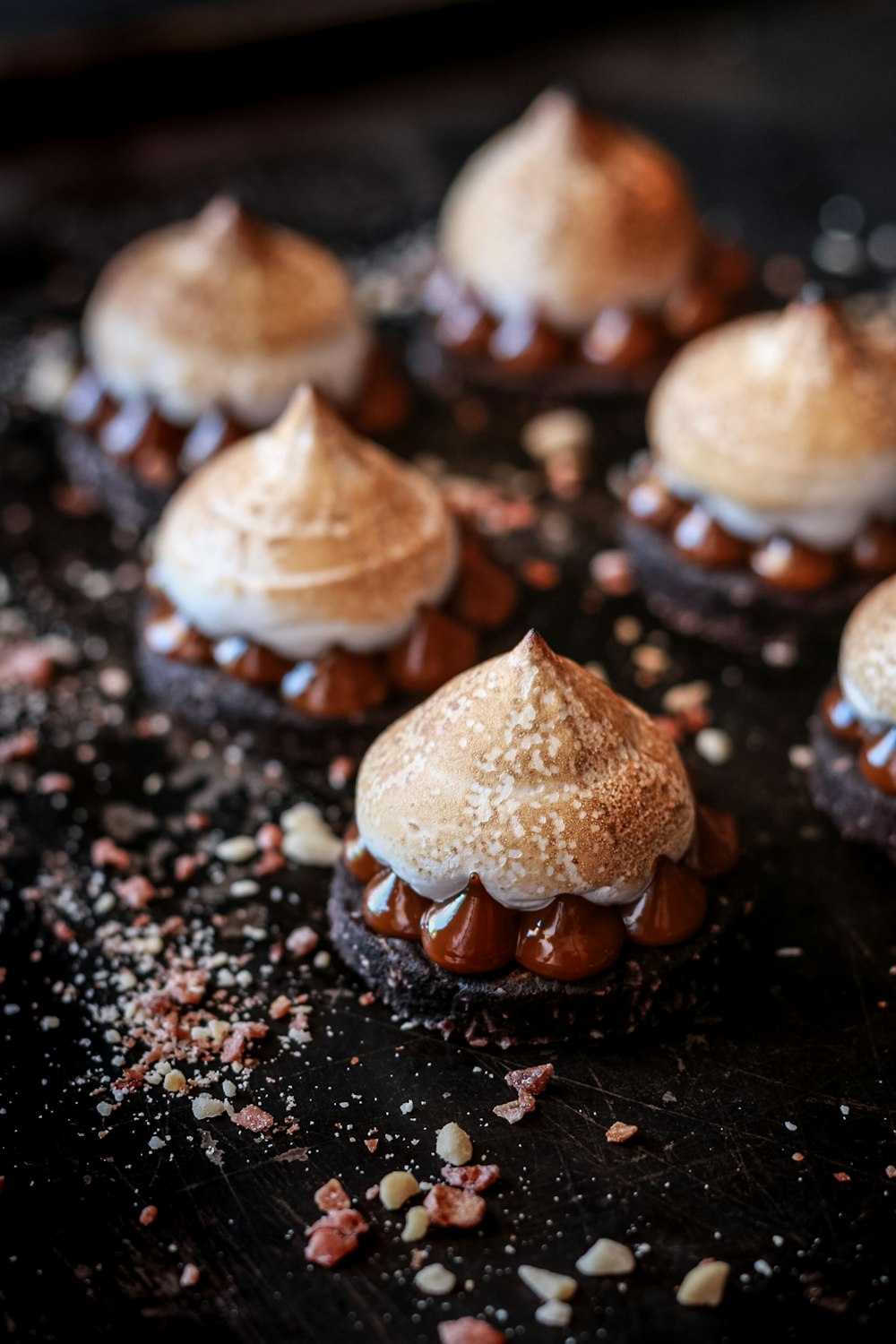 brown and white pastry on black surface