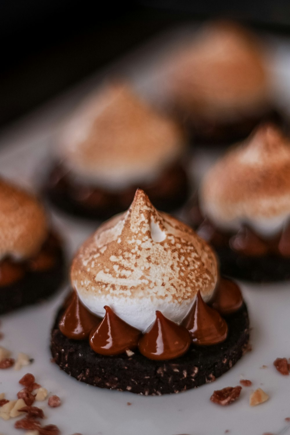 brown and white donuts on white ceramic plate