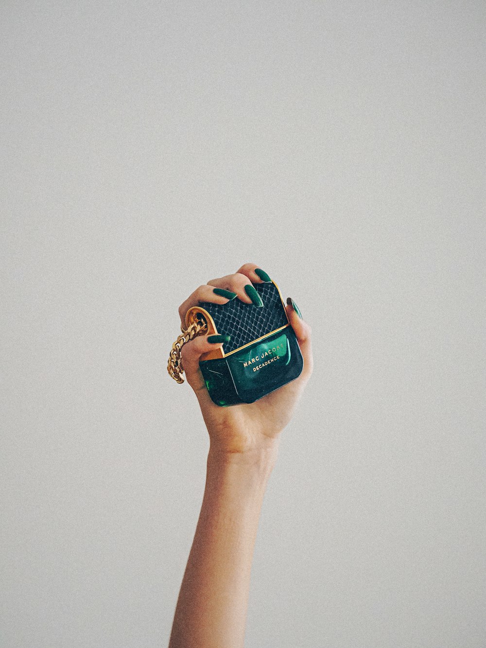 person holding blue and white labeled bottle