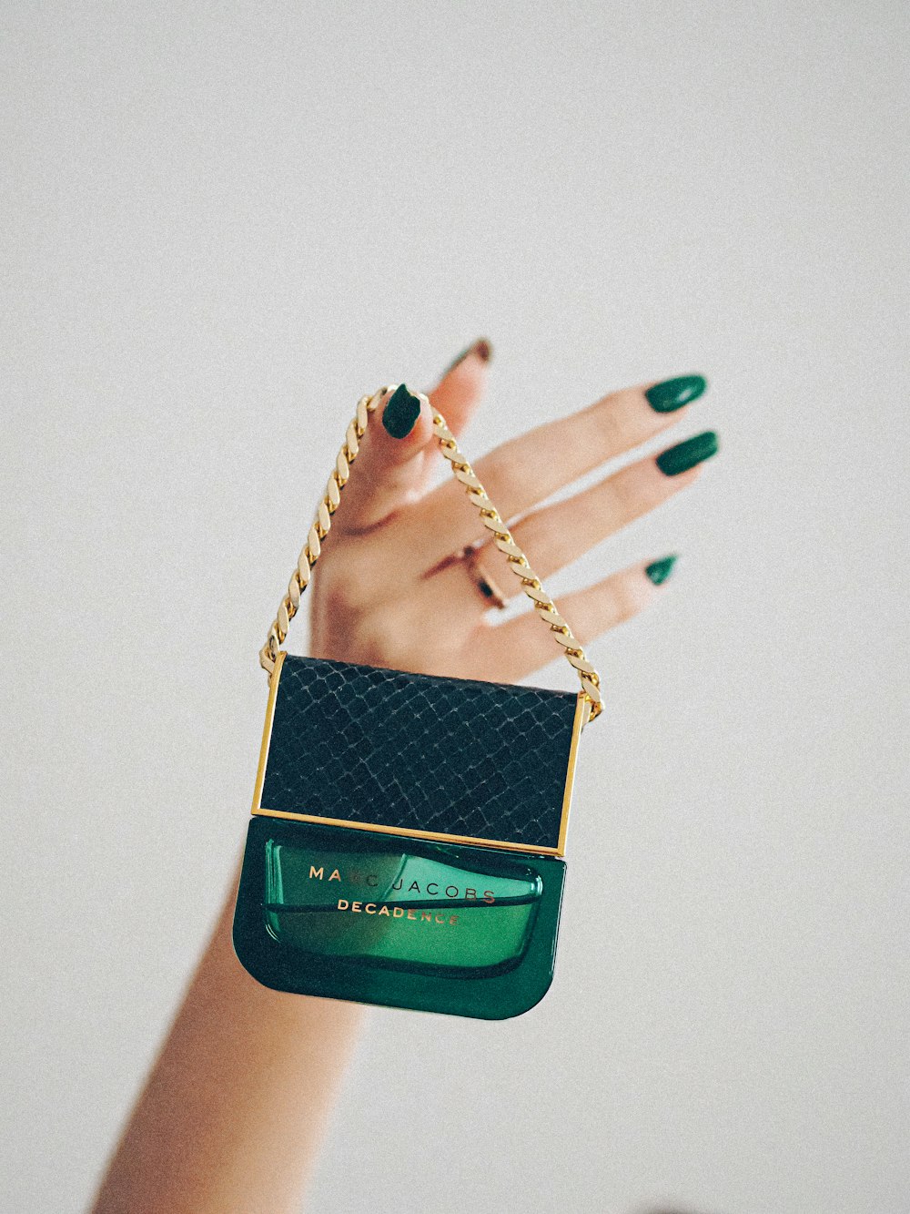 green and gold sling bag