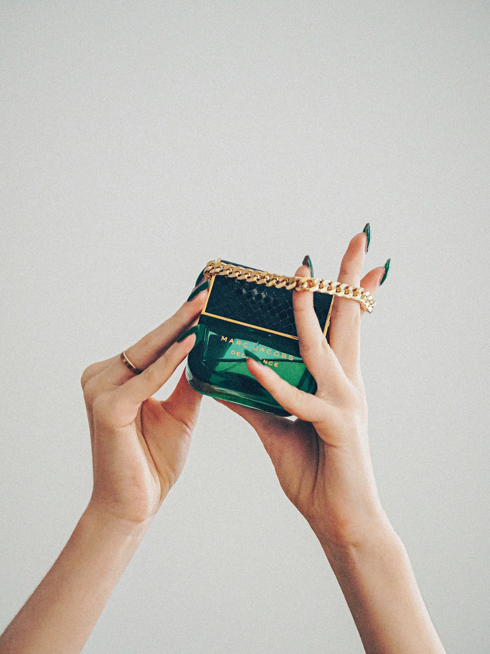 person holding green and brown book