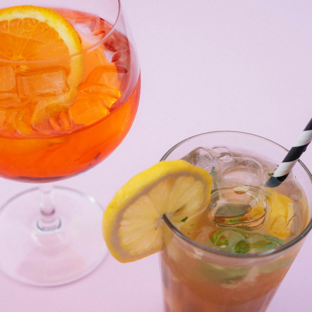 clear drinking glass with orange juice