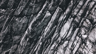 Close-up of basalt rocks freshly extracted, showcasing their rugged texture and deep color