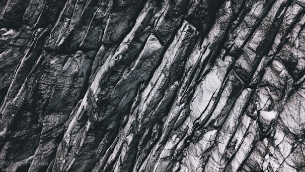 Close-up of basalt rocks freshly extracted, showcasing their rugged texture and deep color