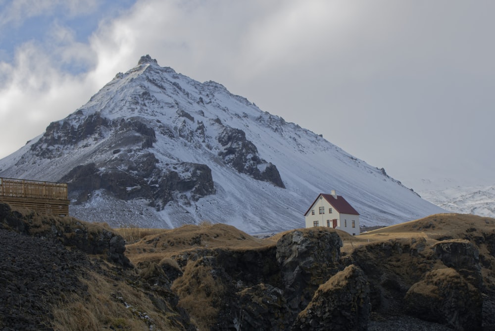 white and brown house on brown rocky mountain during daytime