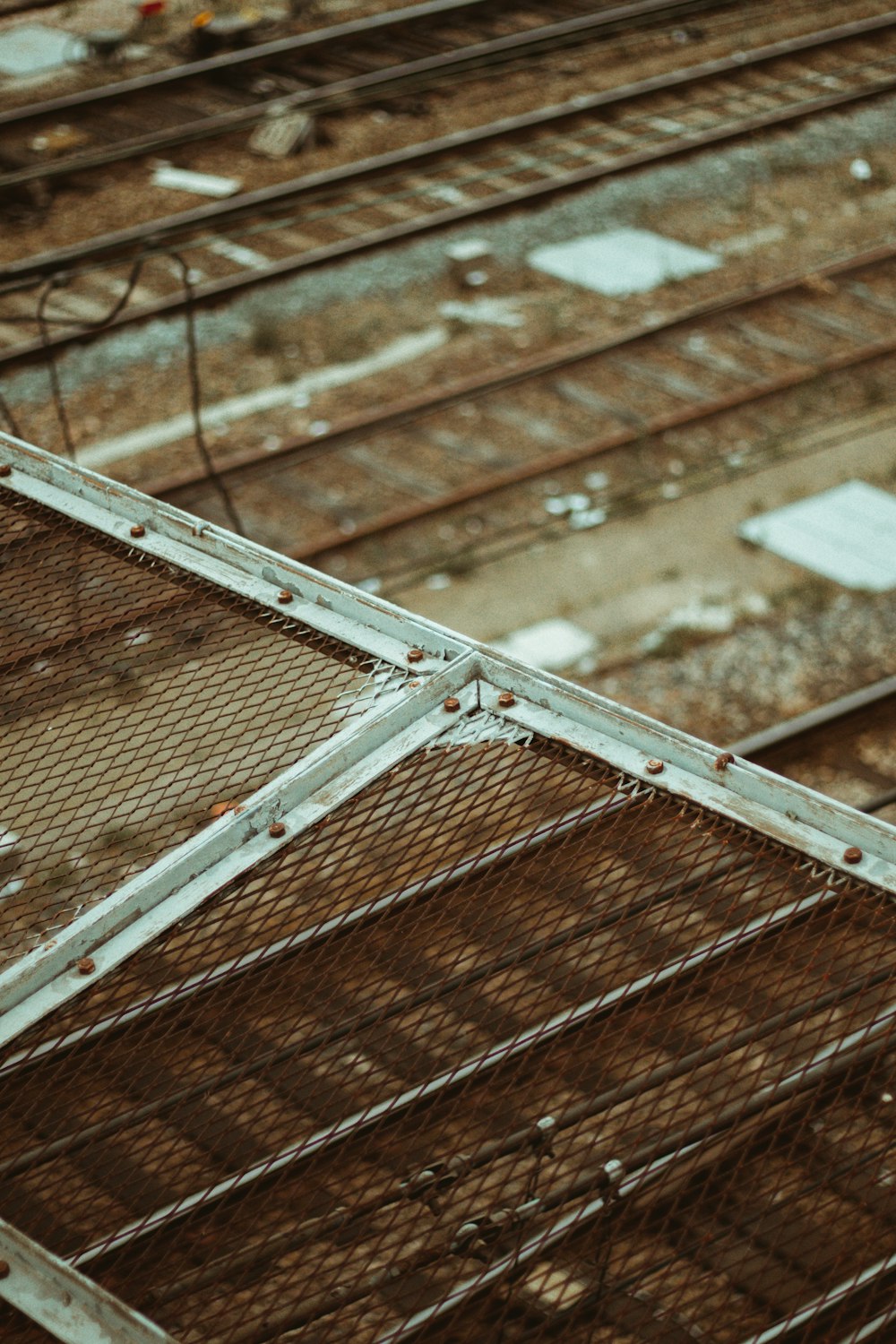 white metal frame on brown wooden floor