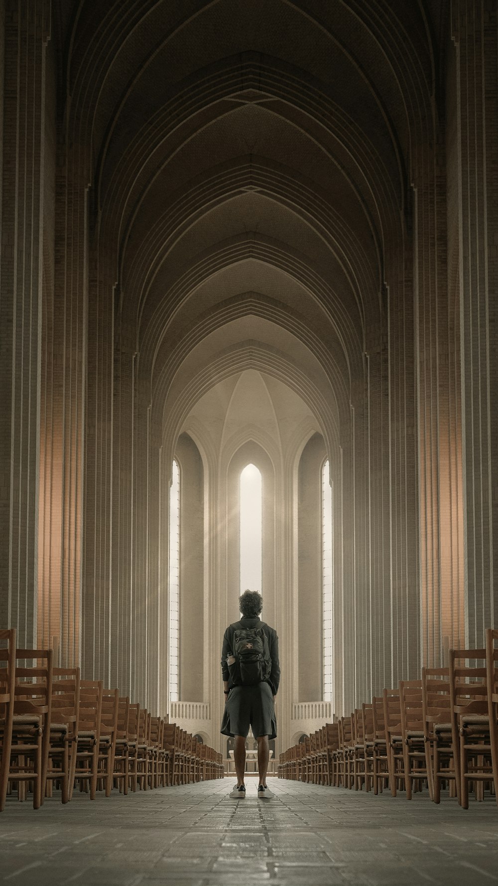 man in black leather jacket standing inside building