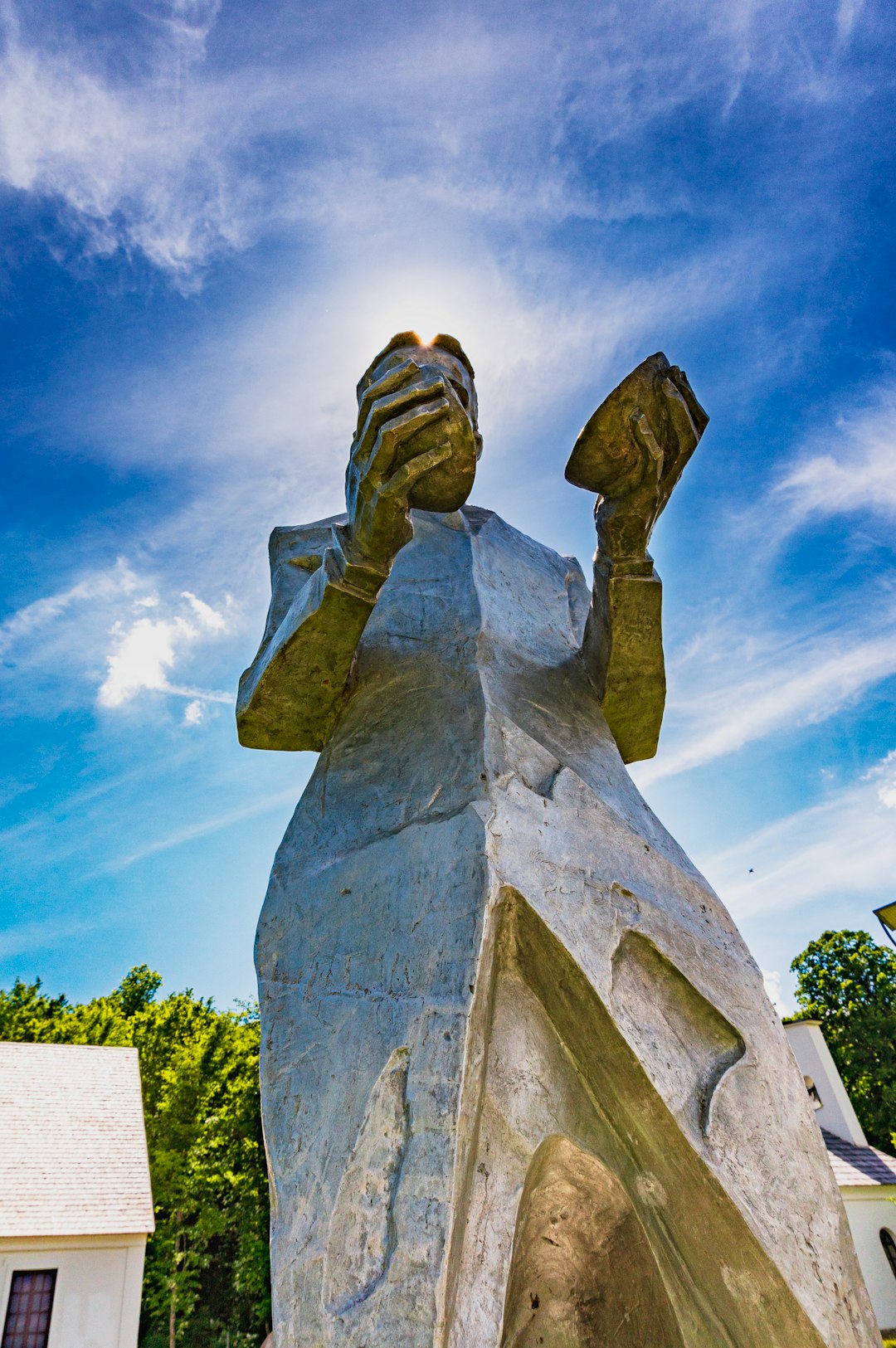 gray concrete statue under blue sky during daytime