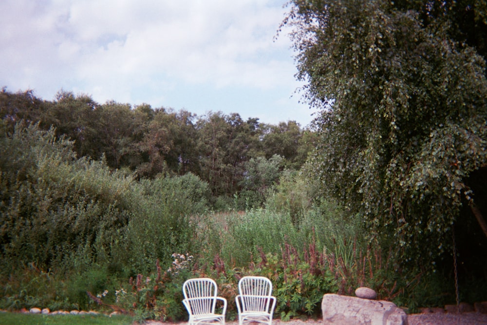 white plastic armchair on brown rock