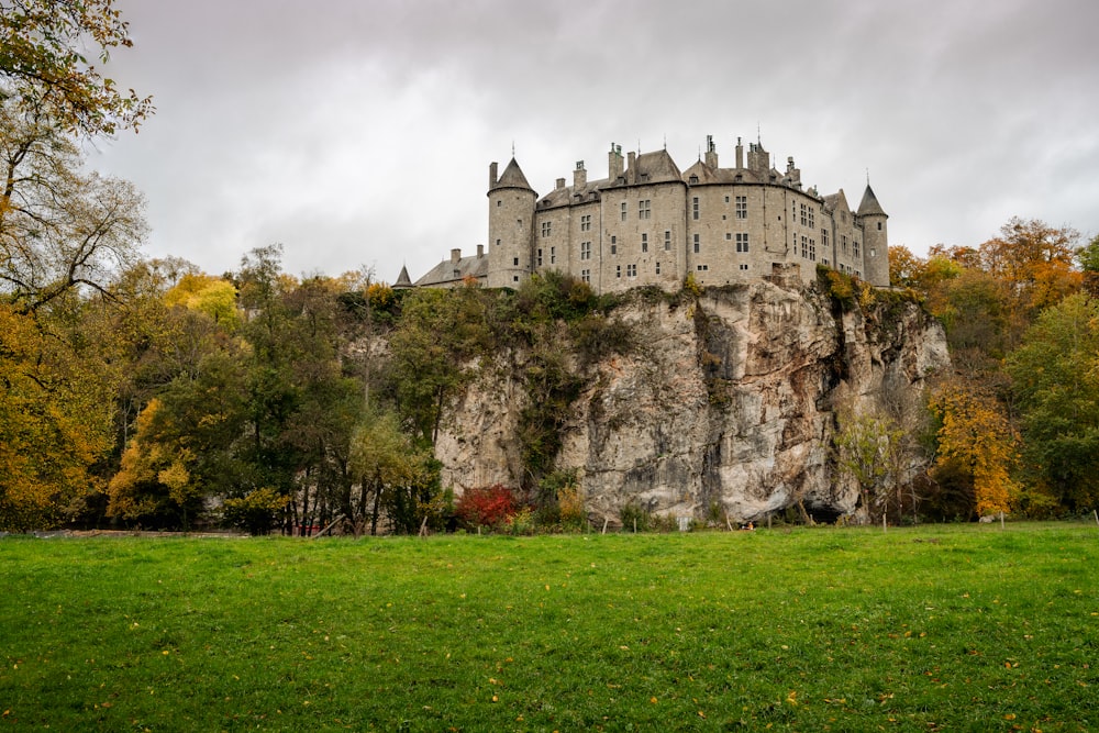 gray concrete castle near green grass field during daytime