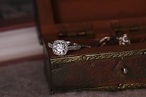 Close-up of a dazzling diamond ring catching the light with a luxurious velvet box.