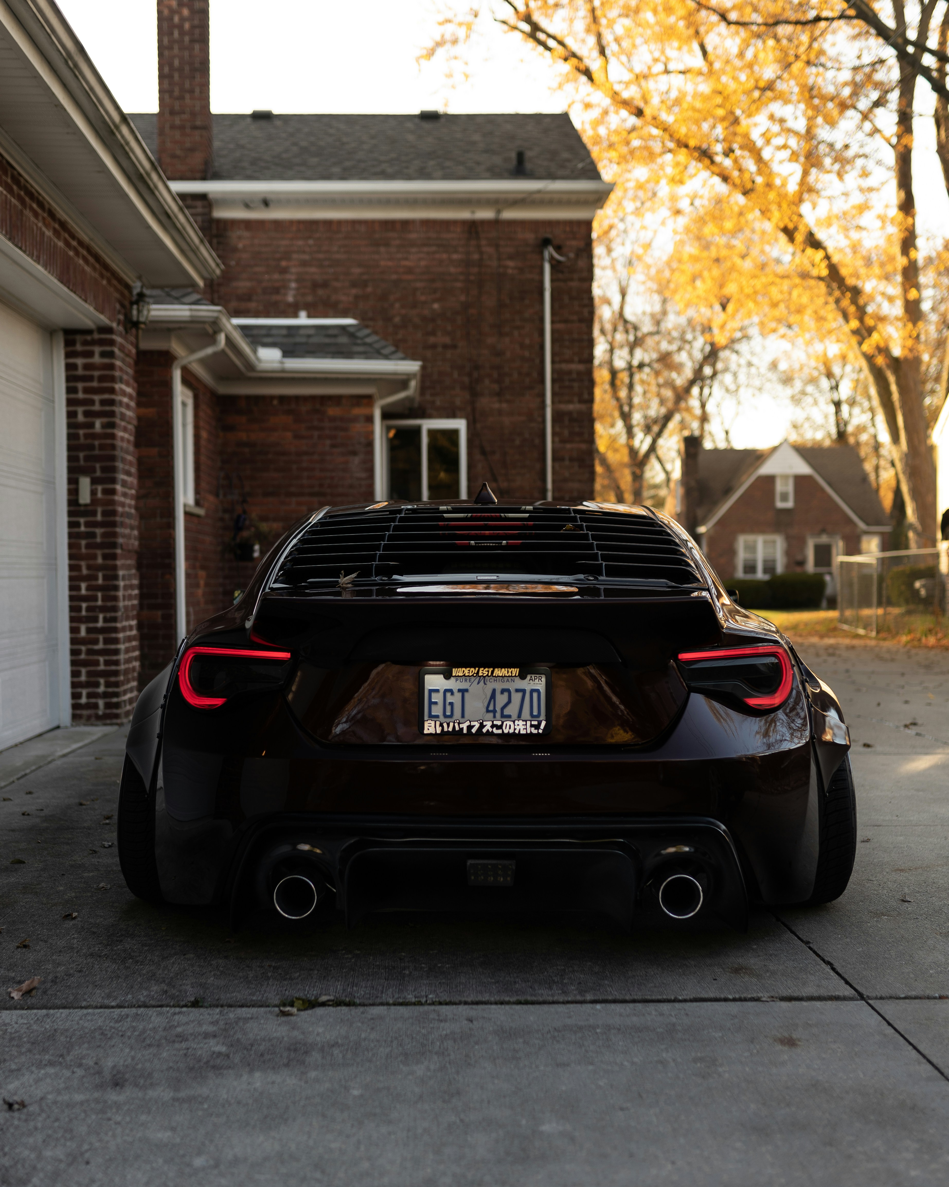 Black Bmw Car Parked Beside Brown Brick Building During Daytime Photo Free Cars Image On Unsplash