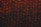 A close-up view of a sheet of bubble wrap with a dark, dramatic lighting. Each bubble is illuminated with an intense red and black contrast, highlighting the texture and translucency of the material.
