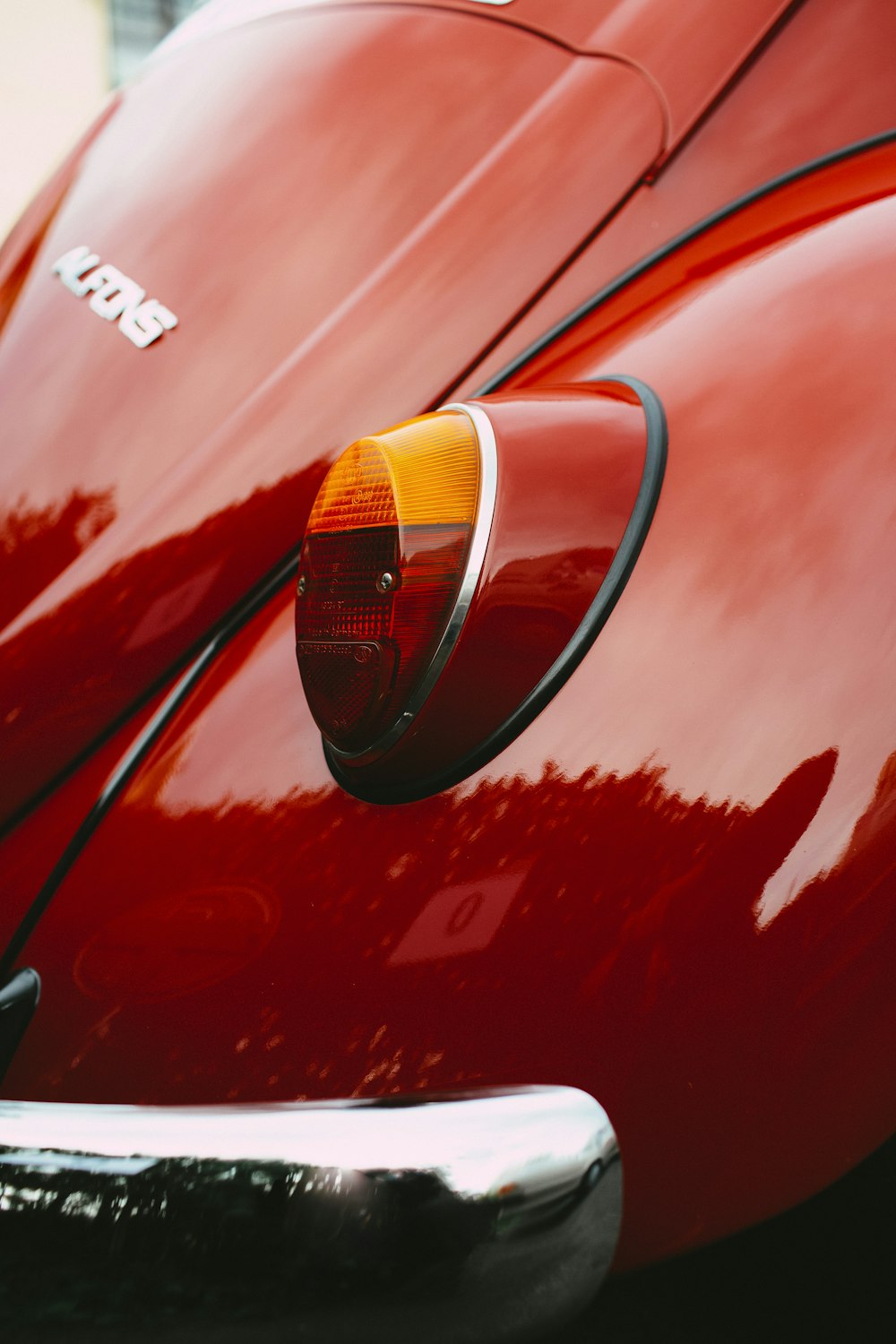 red car with white and black headlights