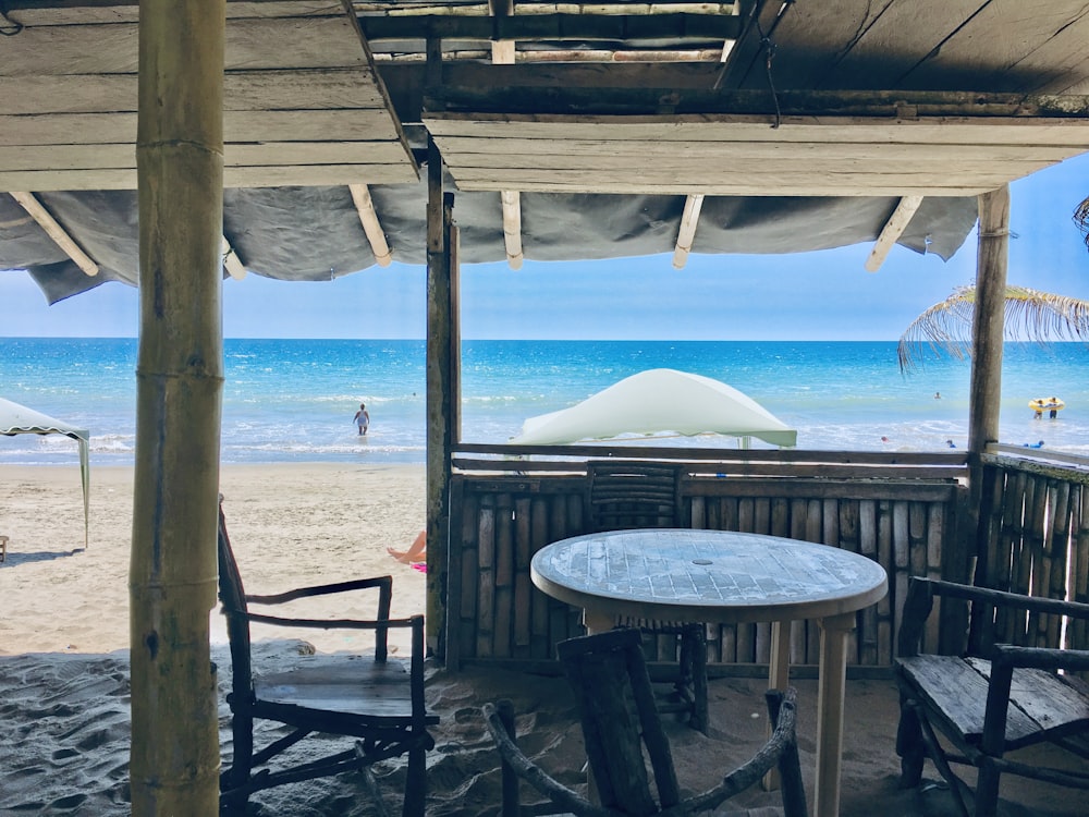 white round table on beach during daytime