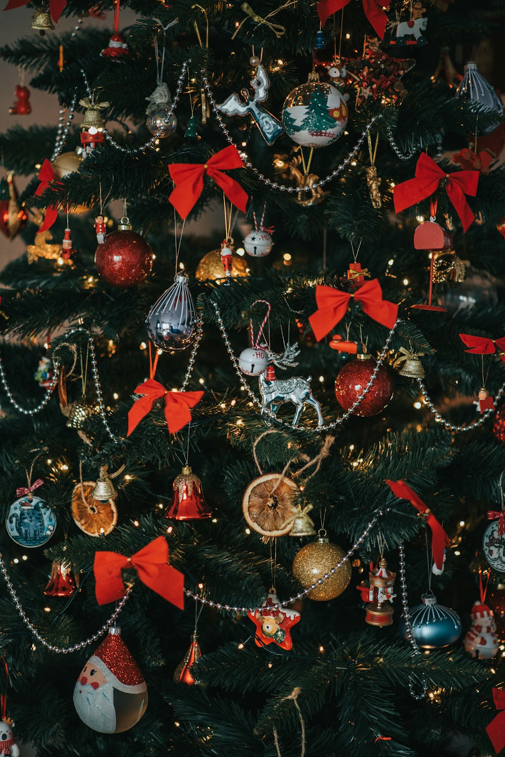 red and gold baubles on christmas tree