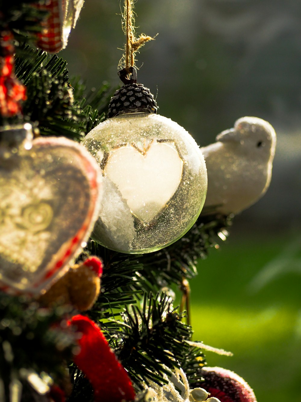 white and red baubles on green christmas tree