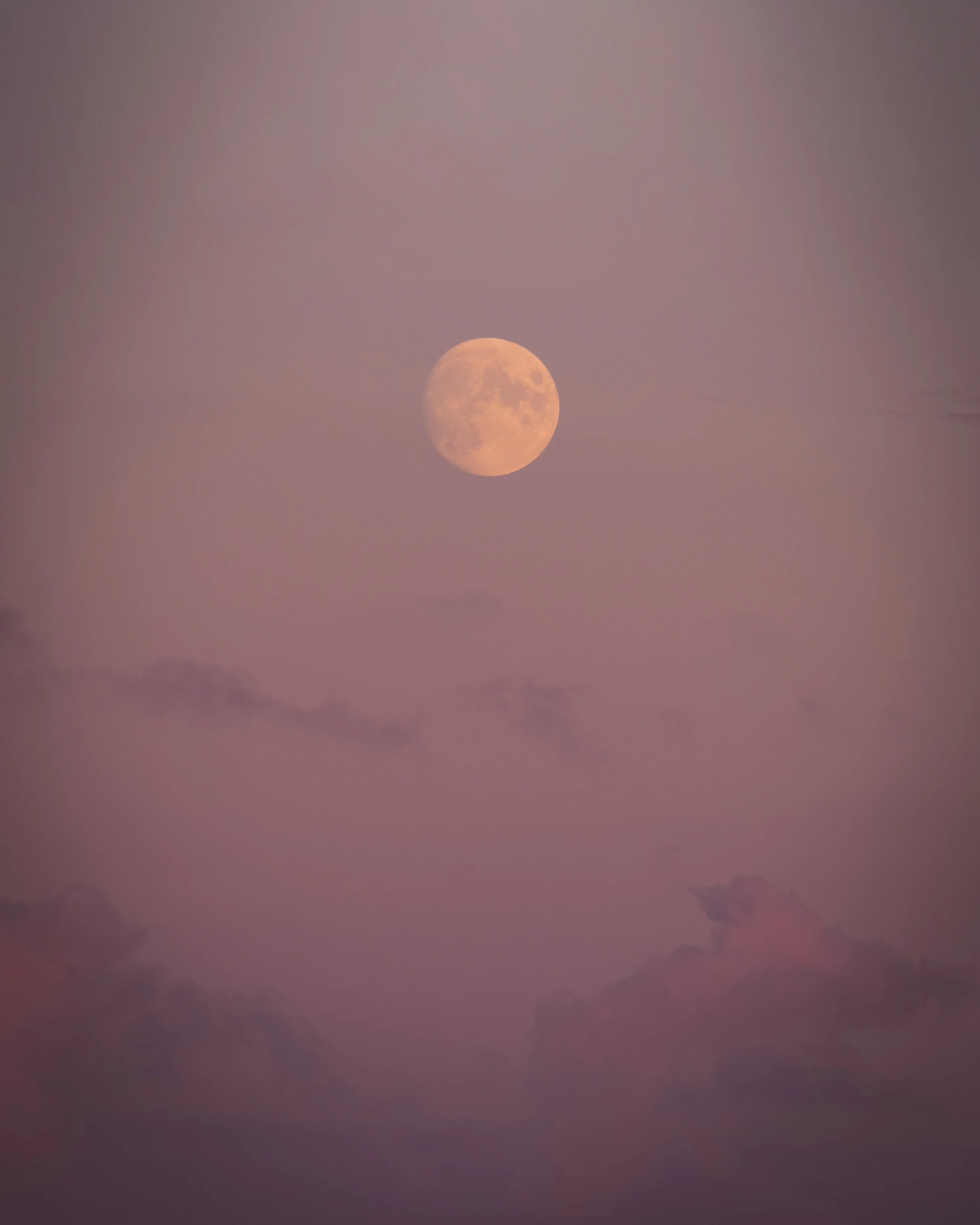 full moon over the clouds