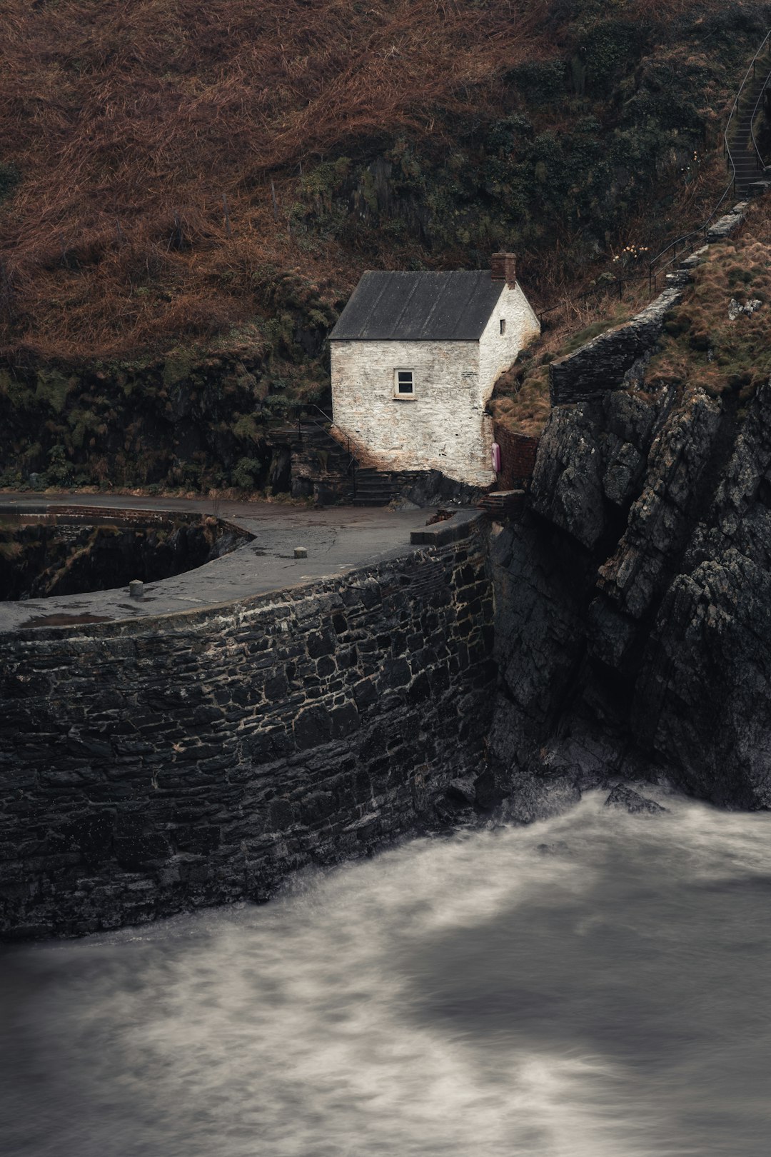 white and brown house beside river