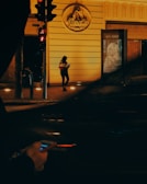 Person walking safely at night with the Bound Defense app active on their phone.