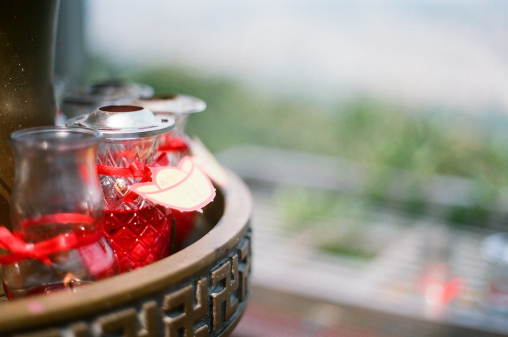 red and silver round container