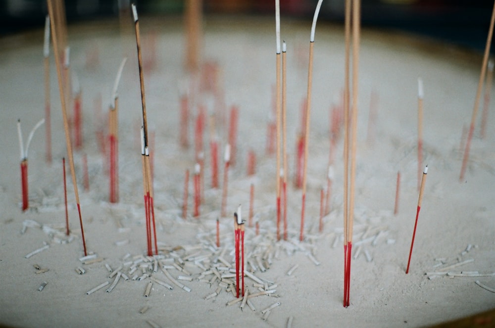 red and white sticks on white surface