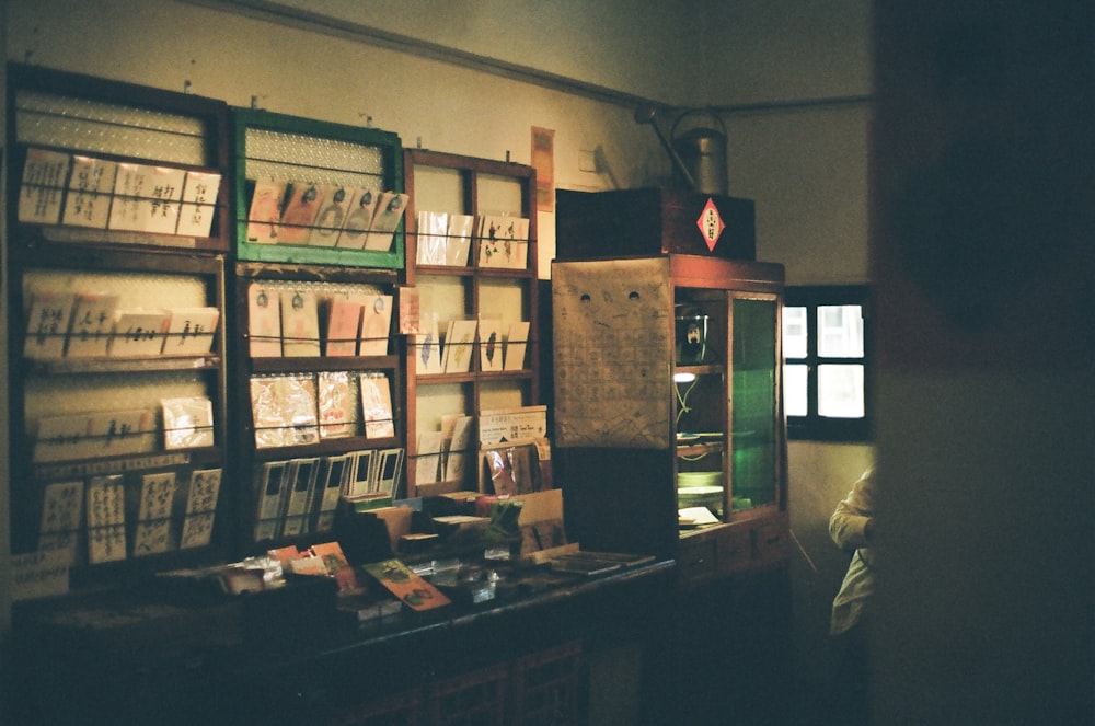 brown wooden shelf with books