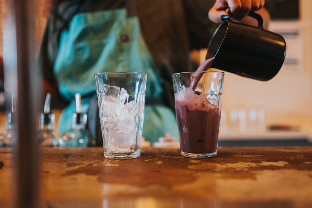 clear drinking glass with ice cubes