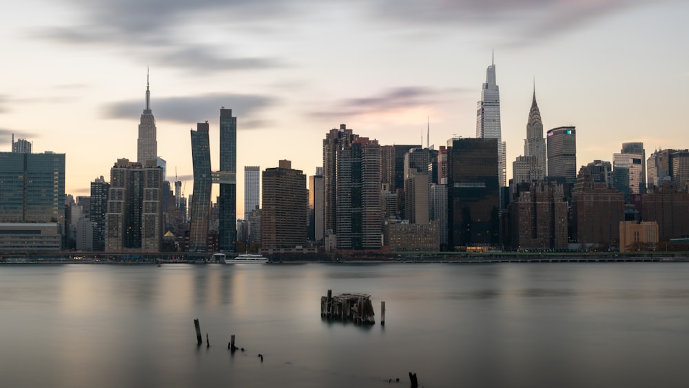 city skyline across body of water during daytime