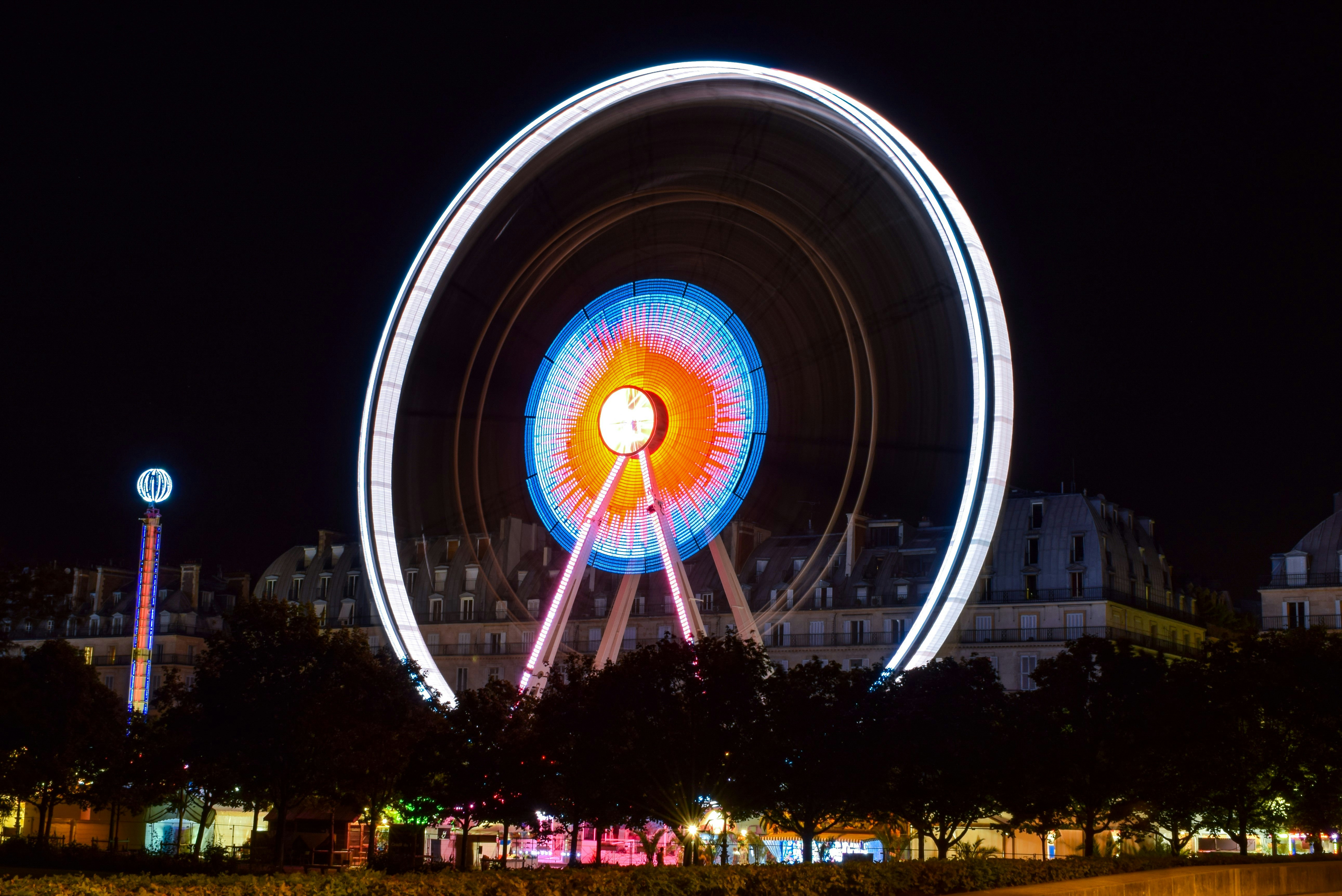 time lapse photography of ferris wheel during night time