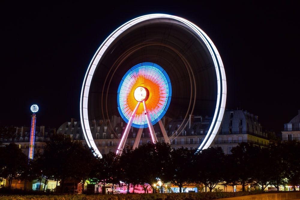 time lapse photography of ferris wheel during night time