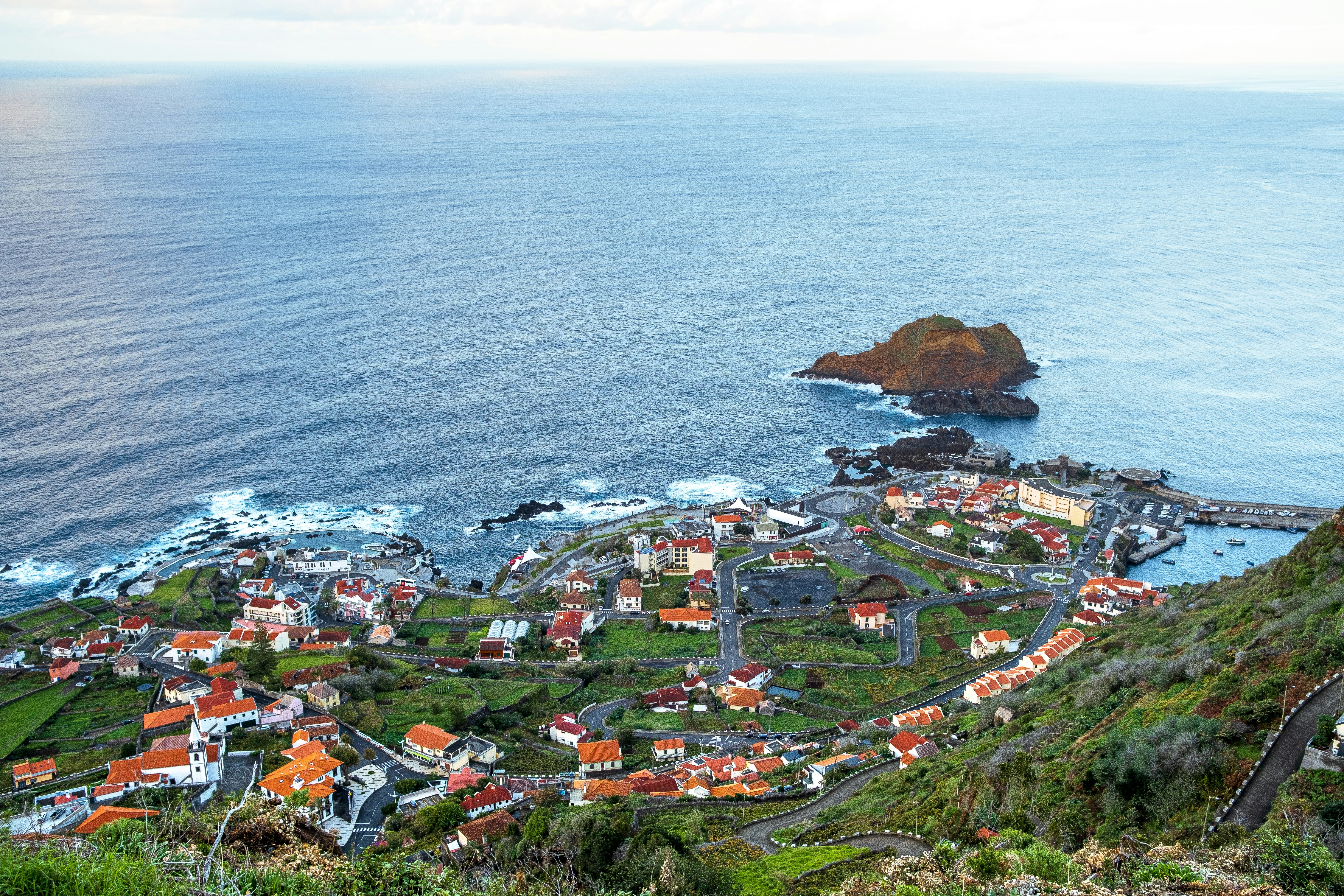 aerial view of city near ocean in madeira