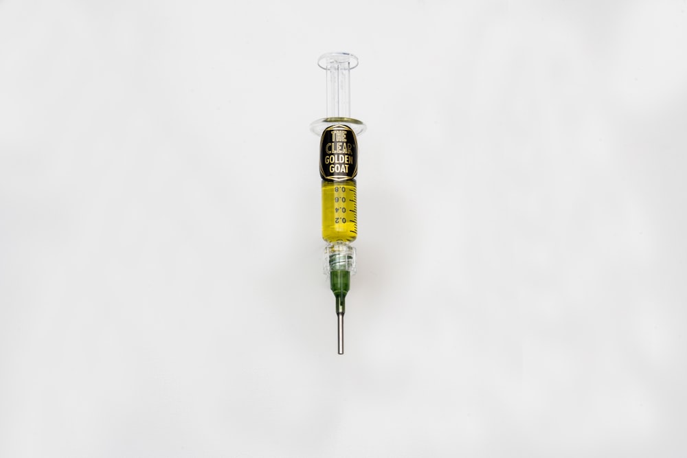 a medical instrument with a needle in the middle of it