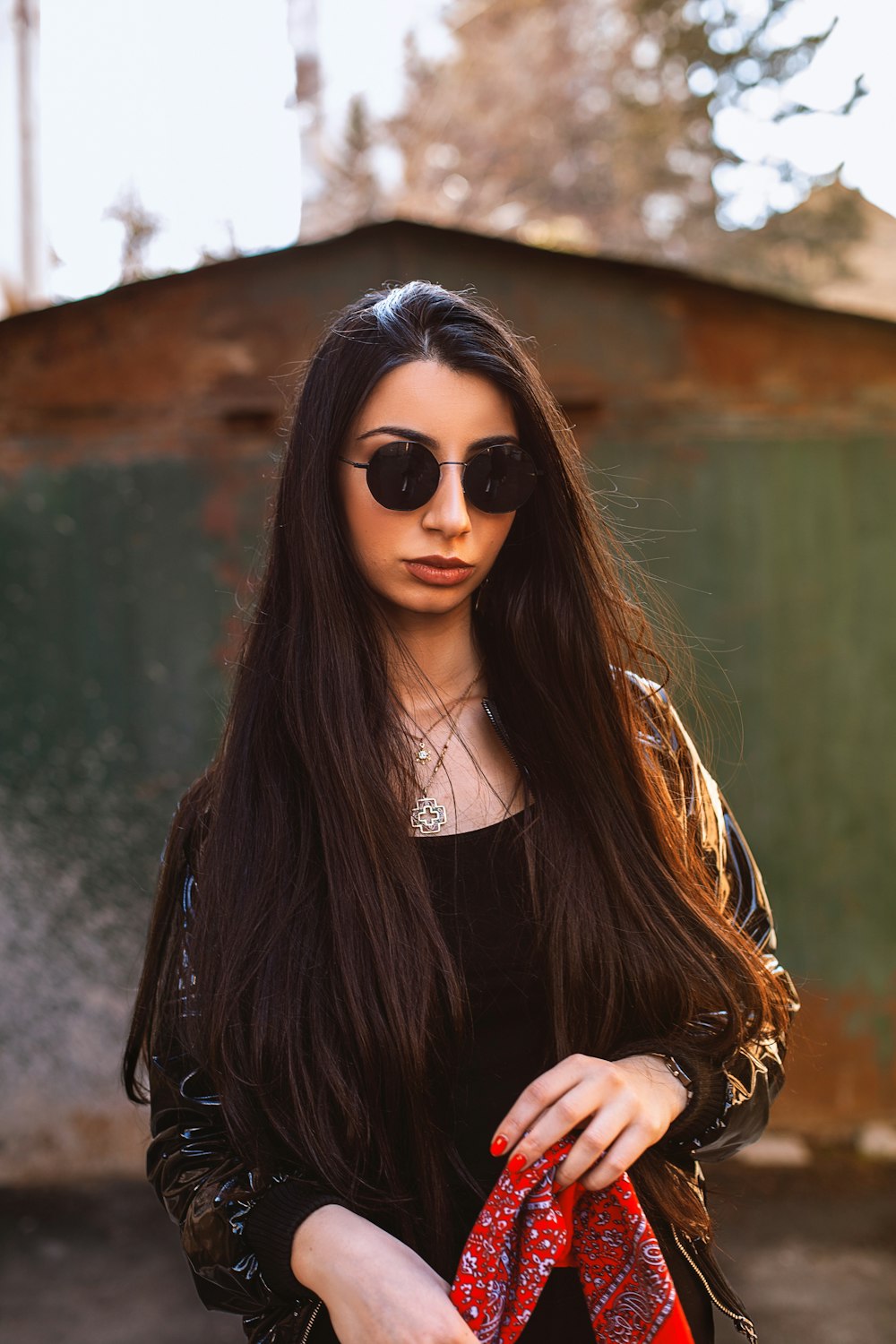 woman in black long sleeve shirt wearing black sunglasses