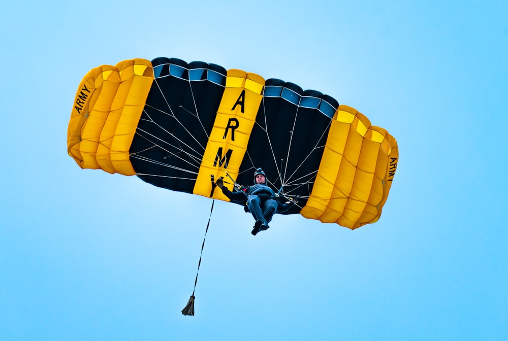 person in yellow and black parachute