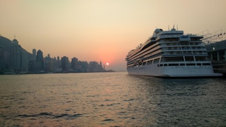 A warm, inviting image of a cruise ship docked at Miami Port during sunset.