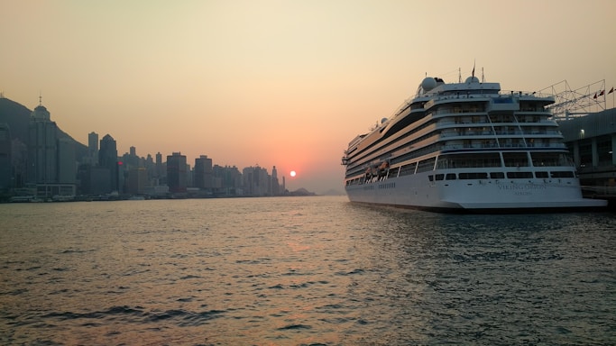 A warm, inviting image of a cruise ship docked at Miami Port during sunset.