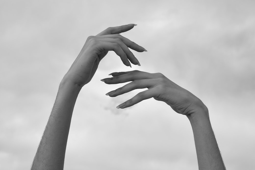 grayscale photo of persons hand