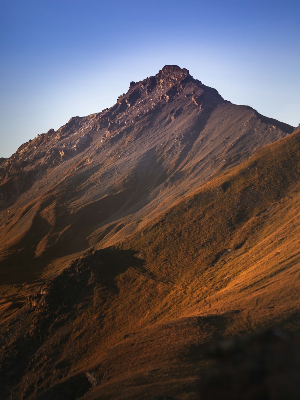 brown and gray mountain under blue sky during daytime