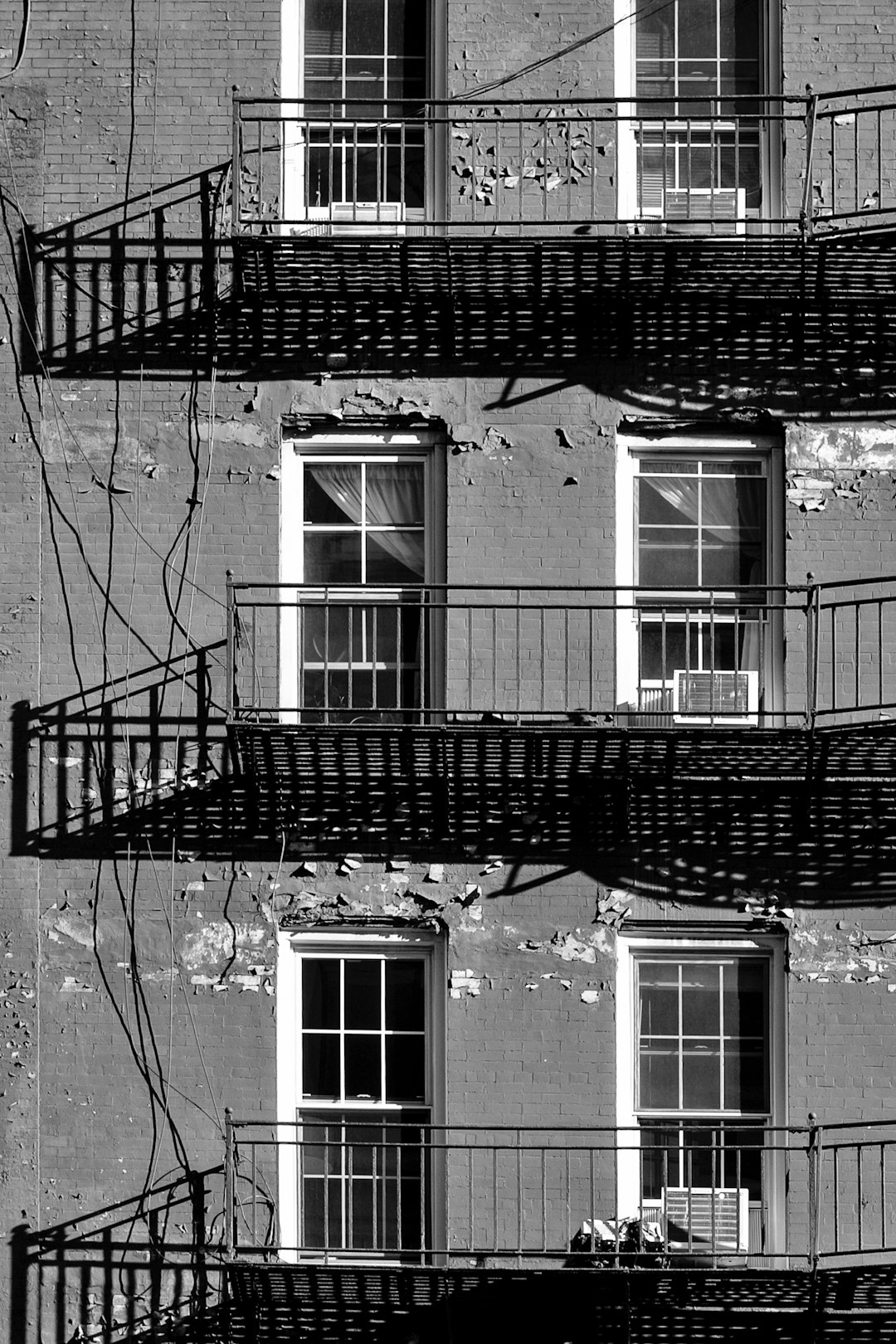 grayscale photo of concrete house