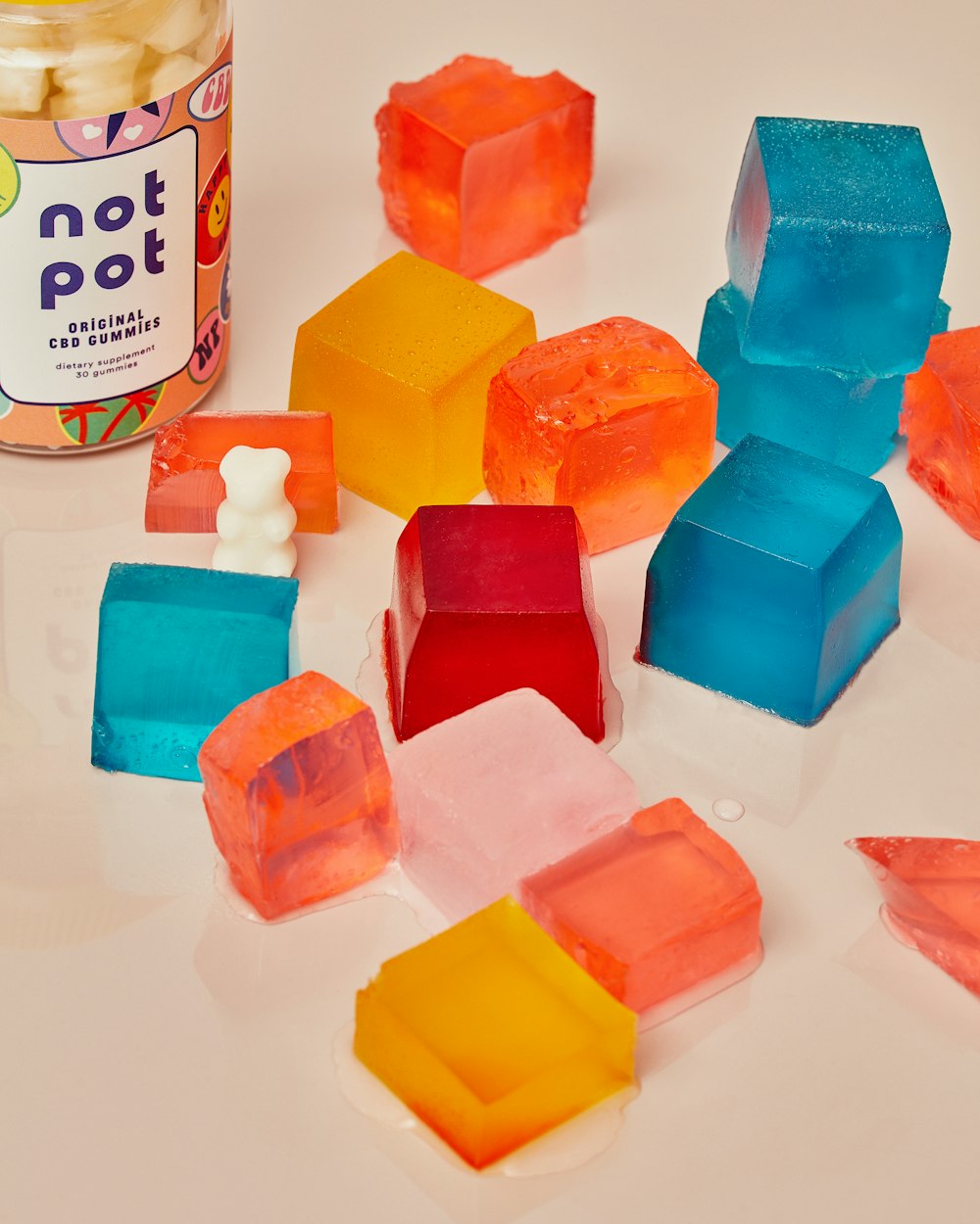 white and yellow plastic bottle beside blue plastic blocks